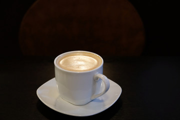 Black hot coffee in Cup in dark key