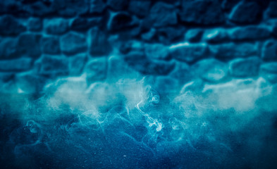 Background of an empty room with brick walls and lanterns. Grunge old brick wall closeup. Neon blue light smoke