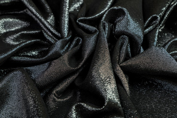  black fabric with sequins is soft folds