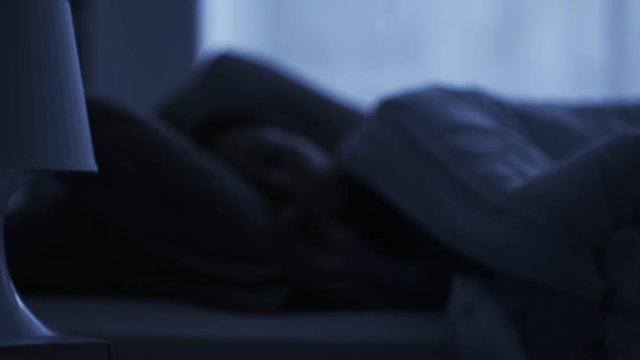 Loud old fashioned alarm clock ringing early in the morning