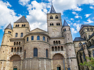 Fototapeta na wymiar Cathedral of Trier and part of the Church of Our Lady exterior view against a beautiful summer sky, in Trier, Germany