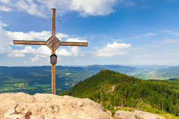 Fototapeta na wymiar Wooden cross on the summit of a mountain Grosser Osser in National park Bavarian forest, Germany.