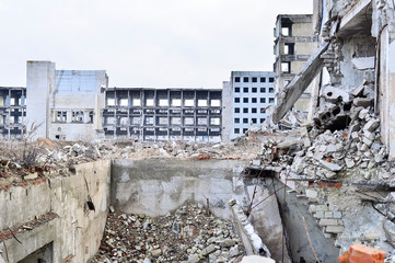 Remains of the destroyed industrial building. Background