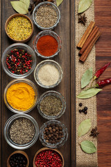 Spices and seasonings on the brown wooden board