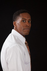 Obraz premium Handsome black man in white shirt and tie