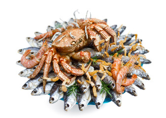 Big hairy boiled crab sits on a heap of dried salted fish on a gift bouquet on the white background