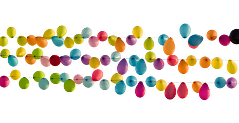 Multicolored balloons on outstretched ropes. Isolated on white background.