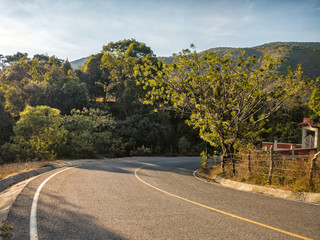 A right curve on a mountain road rural Highway Avenida Cuauhtemoc-Pipincatla in Ixcateopan,...