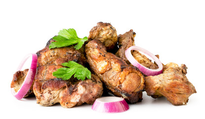 Heap of shashlik with parsley leaves and onion close up on a white. Isolated.