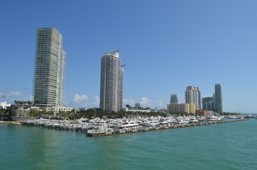 Fototapeta na wymiar Luxury condominium towers overlooking a marina in the south beach section of Miami Beach,Florida