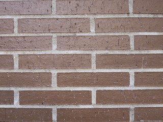 New red brick wall with white joints texture background