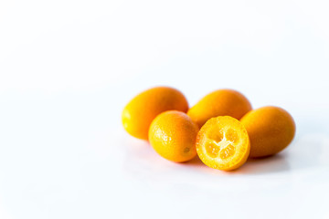 Cumquats on a white background, isolated, close up