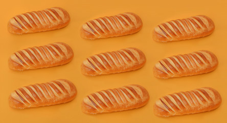 Nine wheat breads on an orange background