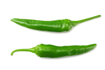 green hot chili peppers isolated on white background top view