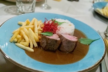 Steak with fries and rice. Slovakia