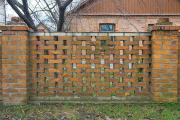 Old brick fence with brick supports