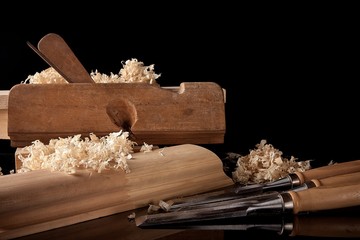 Vintage and the right set of carpenter's tools on the dark background closeup