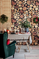 Log of woof wallpaper on the wall of stylish dining room set for Christmas