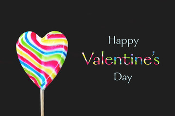  Valentines Day card. Heart shaped lollipop isolated on black background