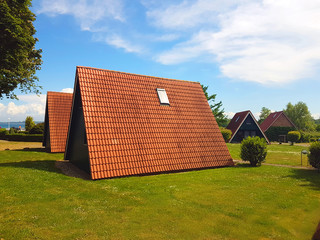 Lovely triangular wooden houses for holidaymakers at a sea