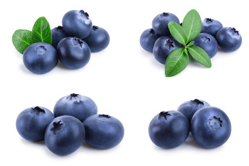 fresh blueberry with leaves isolated on white background closeup. Set or collection