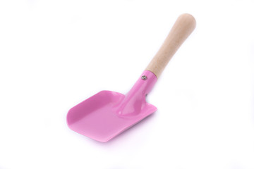 Metal/iron childrens shovel with a wooden handle on a white background isolated close-up. New garden tool. Children wooden/metal toy. Garden equipment. Pink color. Front, side view. Overturned.