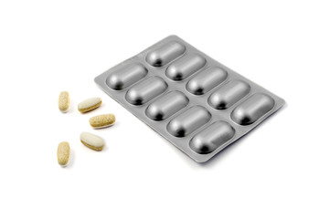 Medicine pills in aluminum foil strip isolated on white background.