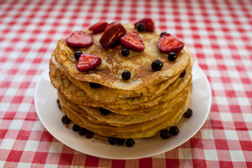 Thin pancakes with crispy crust. Maslenitsa. Pancakes for breakfast and carnival.