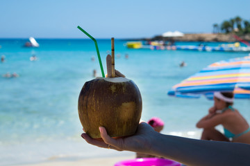 Coconut drink in hand