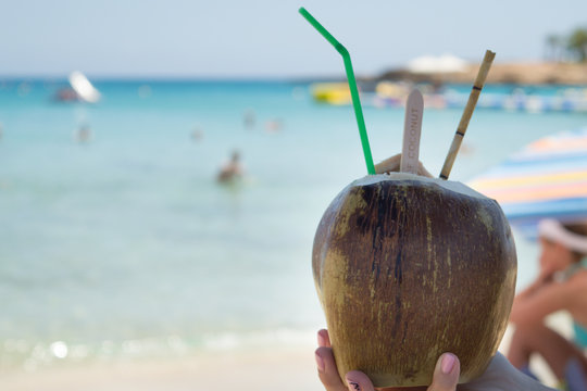 Coconut drink in hand