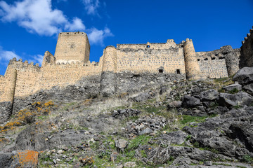 Fototapeta na wymiar ancient antique castle stands high in the mountains