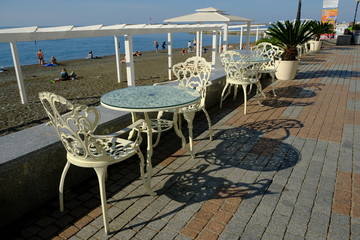table and chairs on the beach