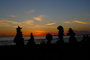 silhouettes of stones on the beach