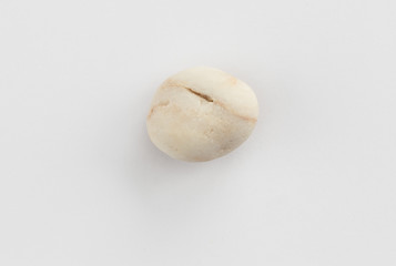 Sea pebble on a white background
