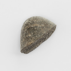 Sea pebble on a white background