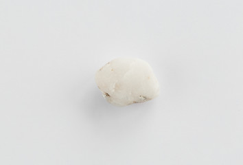 Sea pebble on a white background