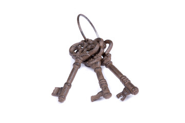 Old key laying on the background. Top view. Close up.Bunch of old keys on white background. 