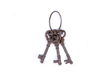 Bunch of old keys on white background. Old key laying on the background. Top view. Close up.
