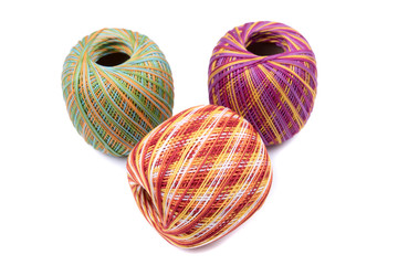 Three balls of yarn. Thread for crochet and  knitting works. Colorful - yellow, orange, red, purple, green yarn balls.  For handwork, leisure, hobby concept. Isolated on white background. Top, front v
