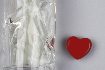 Set of parfume bottle and heart as a symbol of gift with love