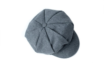 Vintage gray hat on white background. Vintage woolen cap. Man’s accessories: hat.  Front, top view.