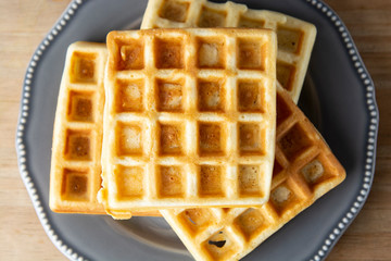 Belgium waffles close up. Homemade breakfast, delcious dessert for children.