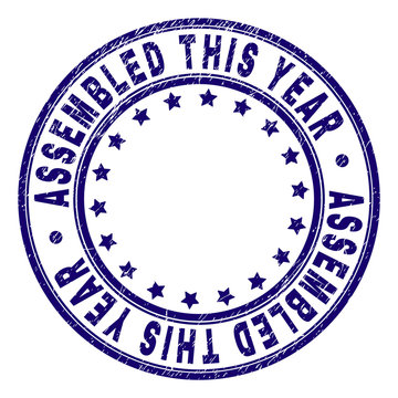 ASSEMBLED THIS YEAR stamp seal imprint with grunge style. Designed with round shapes and stars. Blue vector rubber print of ASSEMBLED THIS YEAR caption with grunge texture.
