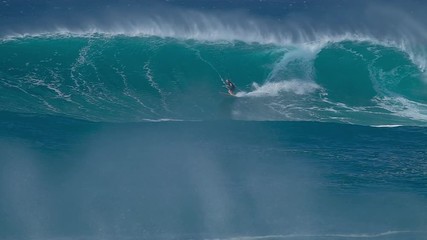 Surfer gets barreled and disappears in a huge wave. The North Shore of Oahu, Hawaii