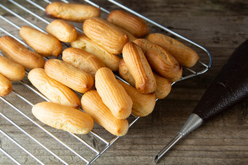 Eclairs or profiterole dessert. Traditional French dessert. Cooking homemade cookies, dessert.