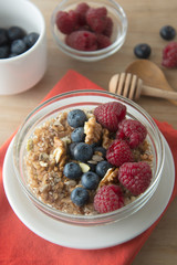 Cereal, muesli and various delicious fruit, berries for breakfast. healthy, energy breakfast, wooden table.