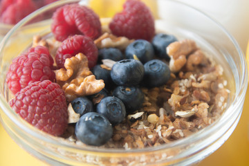 Cereal, muesli and various delicious fruit, berries for breakfast. healthy, energy breakfast, wooden table.