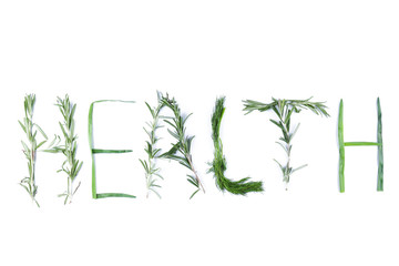 Word Health with green herbs. Dill, rosemary and green onions on a white background. The word Health is isolated. Letters from natural products. Lettering