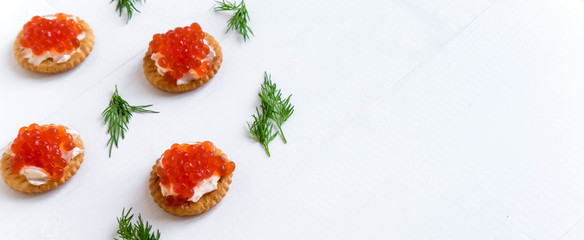 Basis for a banner with sandwiches with red caviar. Salmon caviar for print design, web site, banner, flyer. Appetizer with red caviar