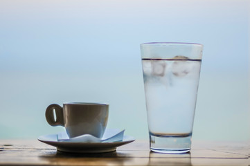 Early morning espresso with ice water